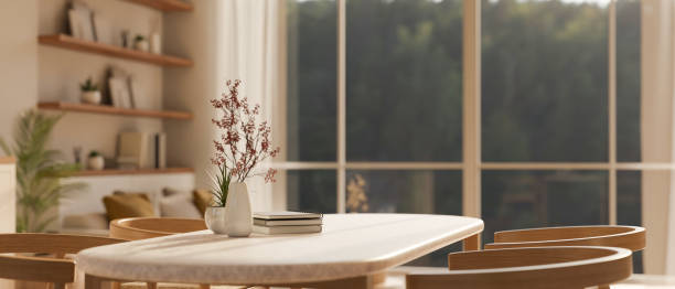 istock Close-up image of a mockup space on beautiful dining table in cozy contemporary home dining room 1473820004