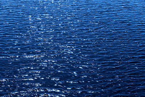 Blue moonlight reflection on the water surface.