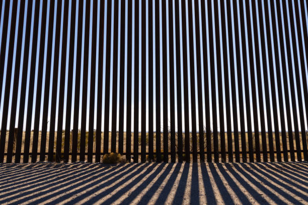 istock El Paso Texas Mexican Border Wall Harsh Shadows Looking Through Wall 1473827407