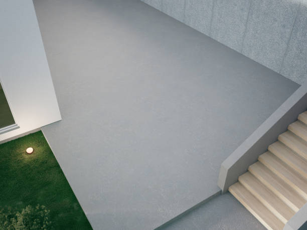 istock House with concrete terrace near empty grass floor. 1473827826