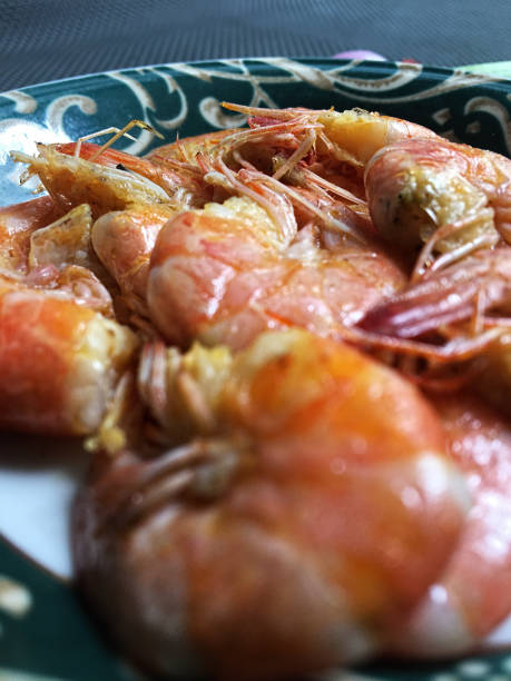 istock Shrimps in plate on a grey concrete background 1473828622