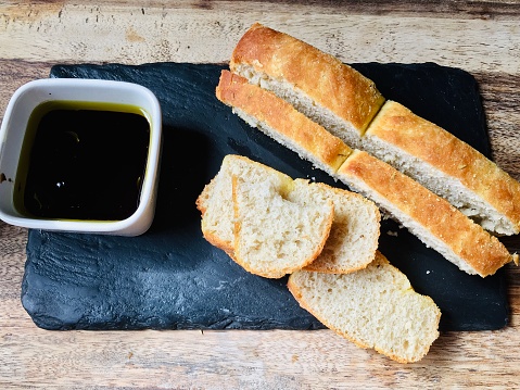 Welsh slate with a home baked organic ciabatta bread and olive oil with balsamic vinegar for dipping