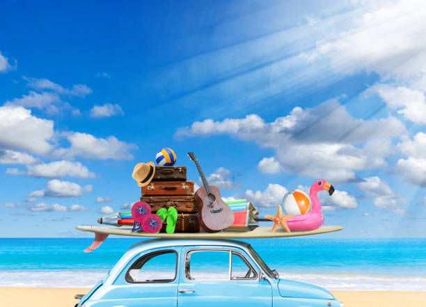 istock Vintage blue car with Surfboard and beach stuff on beach in sunny 1473830406