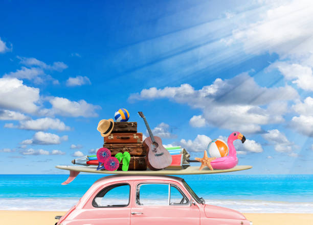 istock Vintage pink car with Surfboard and beach stuff on beach in sunny 1473830417