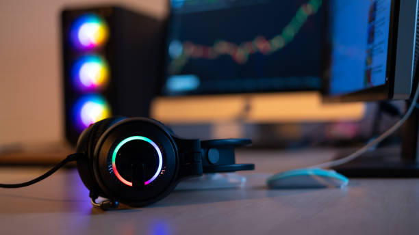 istock Closeup headset soft focus. Professional gamer playing video games on personal pc computer. Colorful neon light room. Esport online game. 1473830426
