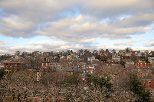 Providence Rhode Island houses on a hill showing historic architecture and old houses and neighborhood with trees and sky showing the cityscape