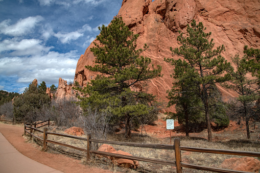 Tall and massive red sandstone formations in the Garden of the Gods at Colorado Springs, Colorado in western USA of North America