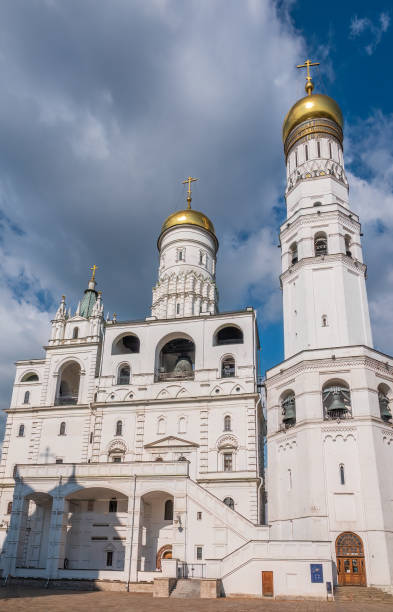 istock Ivan the Great Bell Tower, with Assumption Belfry on the right in Moscow Kremlin. Blue sky background with sunbeams 1473832489