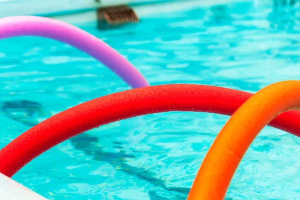 istock Brightly coloured noodles on the pool 1473832565