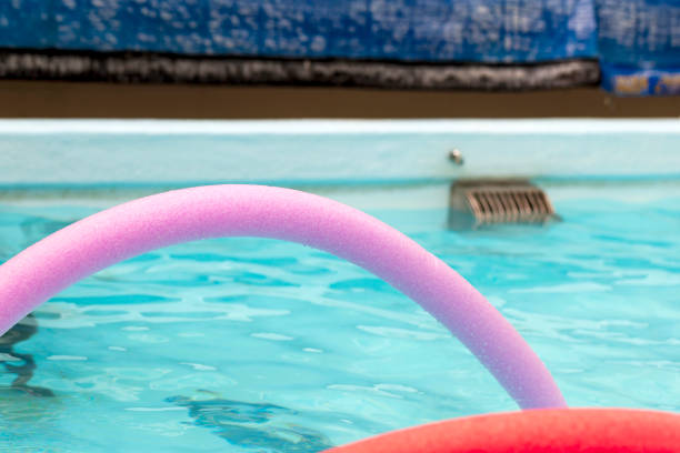istock Brightly coloured noodles on the pool 1473832570