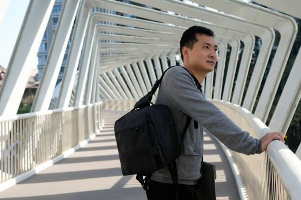 istock Business people taking in the view from the overpass 1473837825