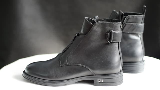 Women's shoes. Pair of ankle boots, black leather.