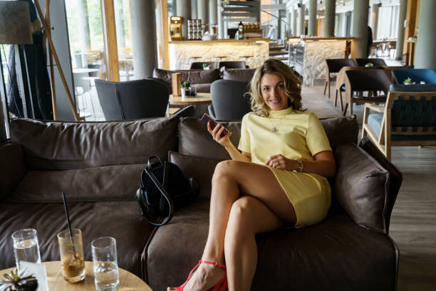 istock Beautiful young woman at hotel restaurant 1473841184