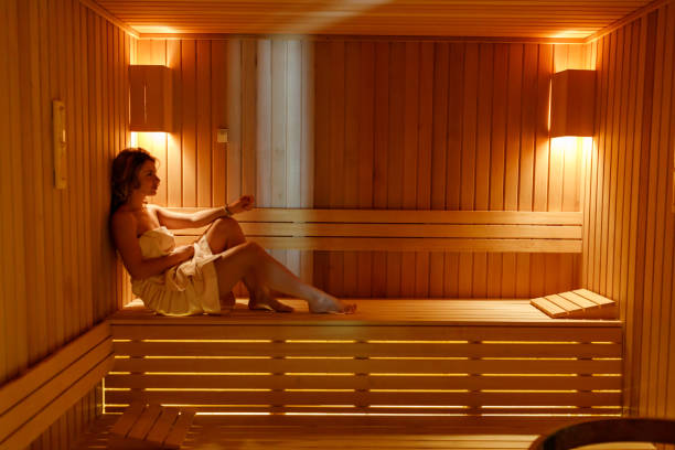 istock Woman relaxing in sauna 1473842088