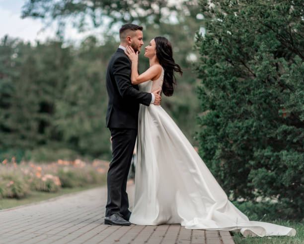 in full growth. bride and groom looking at each other tenderly
