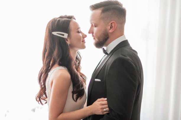 istock close up. happy bride and groom looking at each other 1473844291