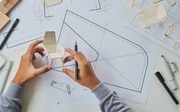 istock Designer sketching drawing design development product plan draft chair armchair Wingback Interior furniture prototype manufacturing production. designer studio concept . 1473846495