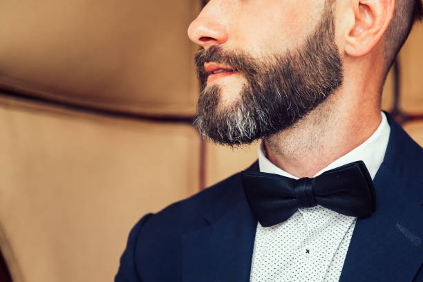 istock close up. handsome man sitting in a chair. 1473848823