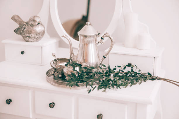 istock coffee service and olive branch on the table in the boudoir. 1473849251
