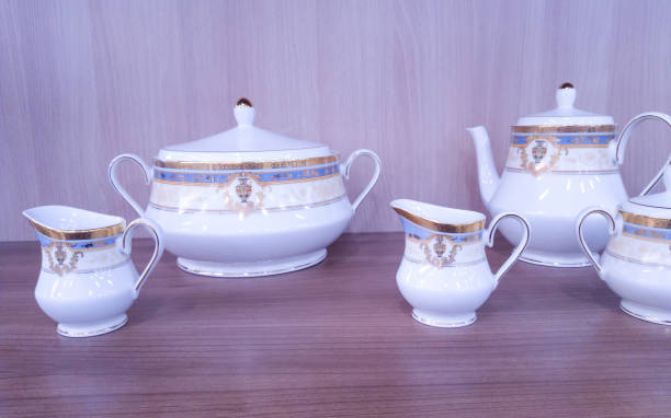 istock Set of teapot and cups on rack at store 1473852893