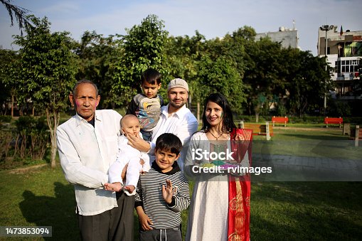istock Family standing in the public park on Holi festival 1473853094