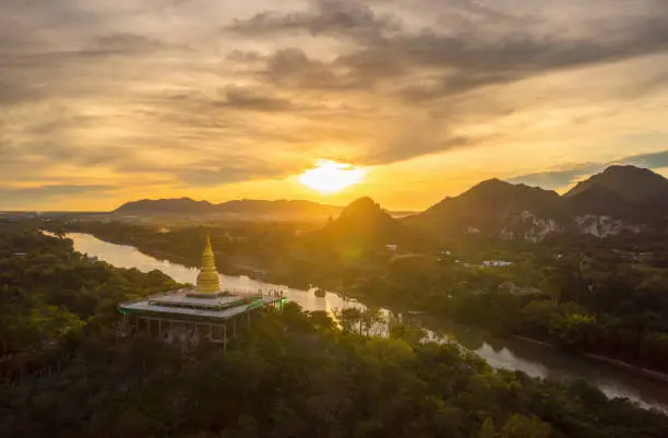 Morning scenery Sunrise over the River Kwai, Wat Tham Khao Pun, Kanchanaburi, Thailand.