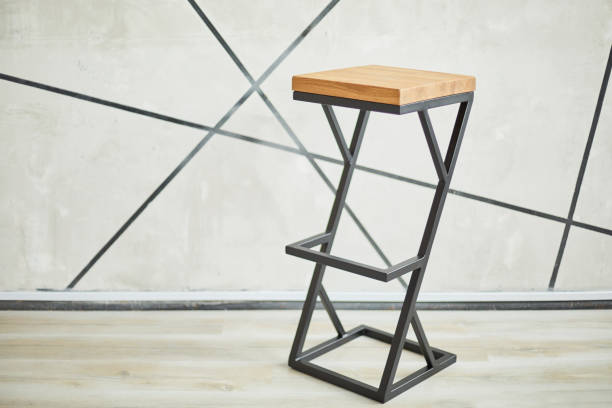 high bar stool made of wood and metal. stock photo