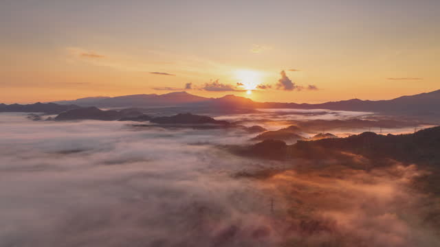 Beautiful morning scenery with mist golden light sunrise on high mountain.