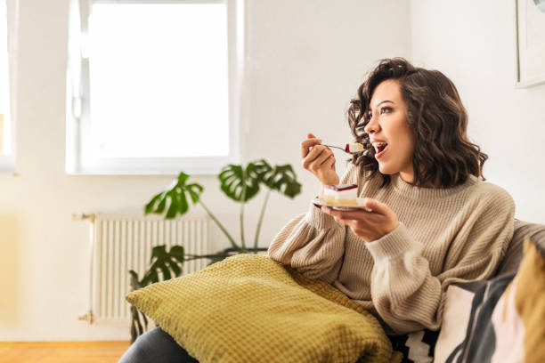 istock Enjoying taste of the cake 1473859798