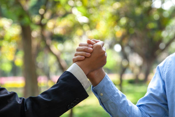 istock business people cooperate to save nature 1473861210