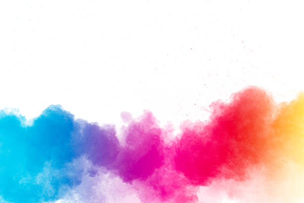 istock Multi colour powder explosion on white background. Launched colourful dust particles splashing. 1473861906