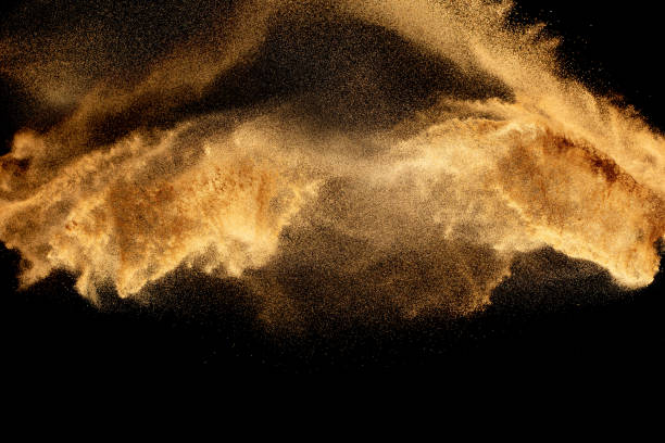 istock Dry river sand explosion.Brown color sand splash against black background. 1473862513