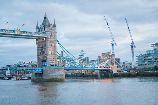The iconic Tower Bridge in London, England, daytime, cloudy day