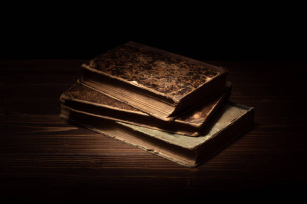 istock Antique books on a wooden table. 1473866356