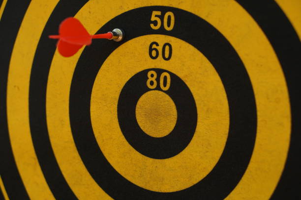 istock Darts on black and yellow targets 1473868120