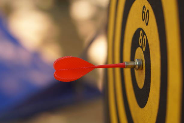 istock Darts on black and yellow targets 1473868681