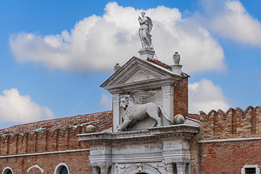 Venice - Italy. February 5, 2023: Richly decorated portico over the main entrance to the Venetian Arsenal