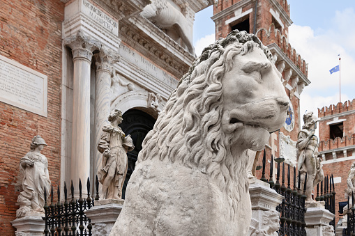 Venice - Italy. February 5, 2023: Ancient greek statue Piraeus Lion at the entrance of Venetian Arsenal. Italy