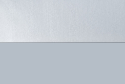 Blank Sheet Of Paper Split In Half Isolated On White Background With