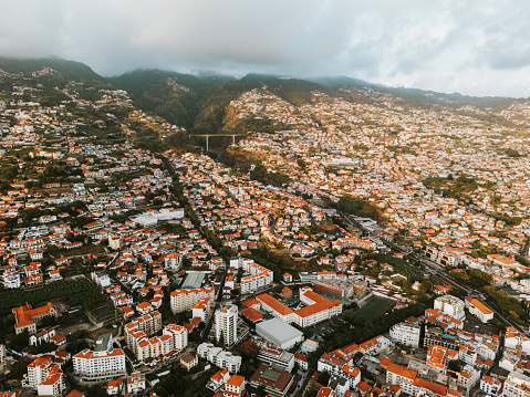 Drone shot of Madeira island capital of Funchal in the sunset during summer evening