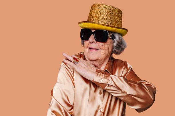 istock Old funny stylish grandmother gesturing with hand on shoulder 1473873863