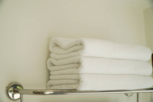 istock Clean white towels on prepared hangers. 1473875494