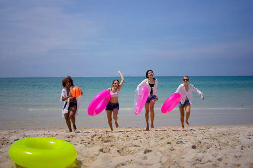 Teenage women travel on the beach. Travel, vacation and Relaxation concept.
