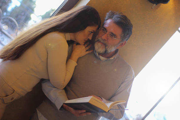 istock Couple in love reading book 1473876747