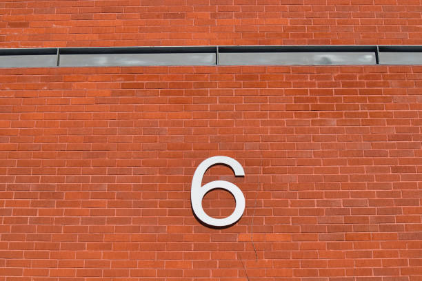 istock number six on a brick wall outdoors 1473876768