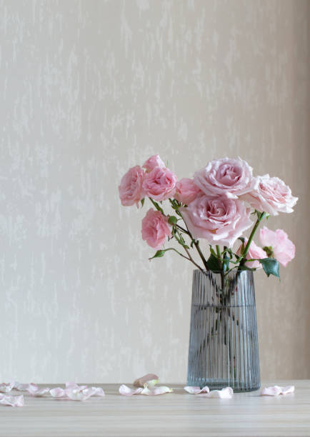 istock still life with pink roses in glass vase 1473876802