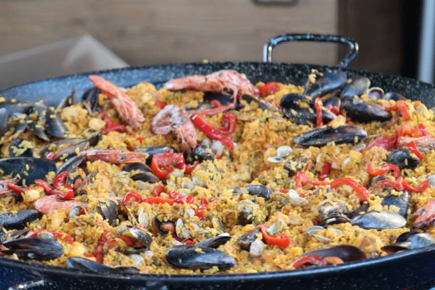 istock fish and rice paella to cook in a pan 1473877945