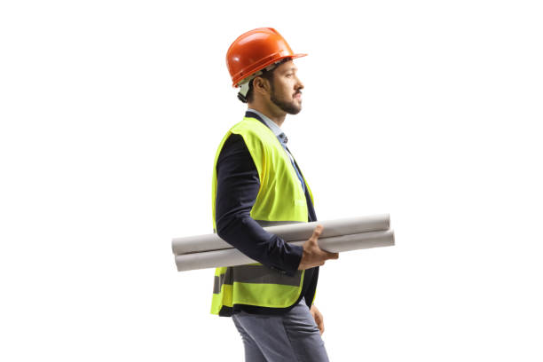 istock Male site engineer with a safety equipment carrying blueprints 1473878995