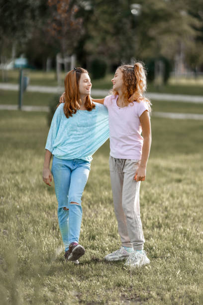 Free Stock Photo of Full-lenght outdoor portrait of two friendly happy ...