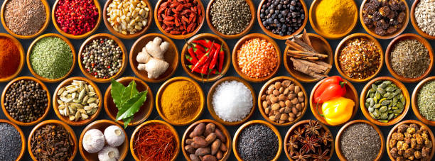 istock Colourful background from various herbs and spices for cooking in bowls 1473879536